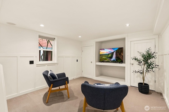 109 E Roanoke St, Seattle, WA 98102 - living area with a decorative wall, carpet floors, a wainscoted wall, and recessed lighting