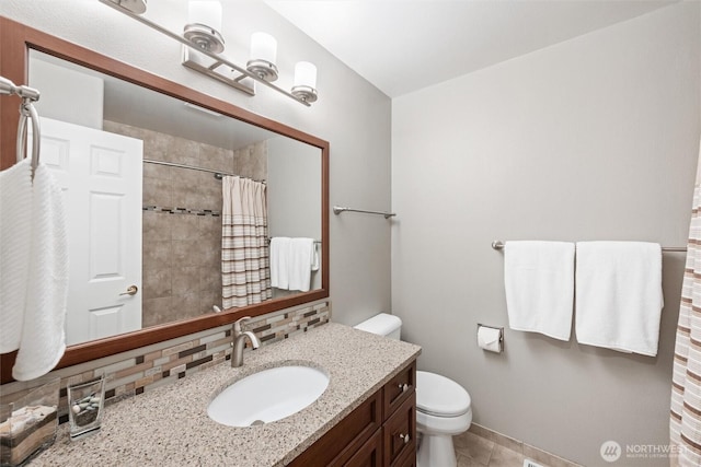 1402 Langara Cir, Bellingham, WA 98229 - bathroom featuring backsplash, vanity, a tile shower, and tile patterned flooring