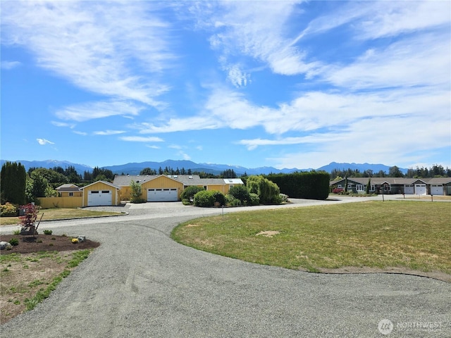 71 Falconcrest Ct, Sequim, WA 98382 - view of front facade featuring driveway, a mountain view, and a garage