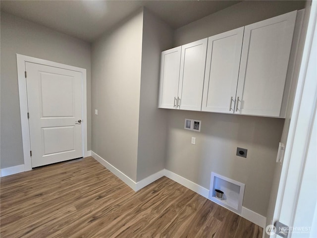 71 Falconcrest Ct, Sequim, WA 98382 - laundry area featuring electric dryer hookup, cabinet space, washer hookup, and wood finished floors
