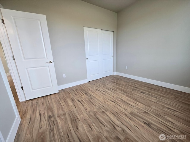 71 Falconcrest Ct, Sequim, WA 98382 - unfurnished bedroom with wood finished floors and a closet