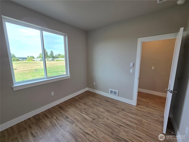 71 Falconcrest Ct, Sequim, WA 98382 - spare room with wood finished floors and baseboards