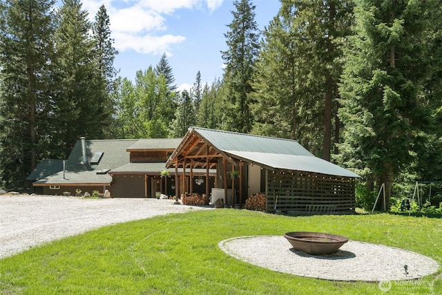 16845 Second Creek Rd, Leavenworth, WA 98826 - view of front of house featuring a front lawn, an outdoor fire pit, and driveway