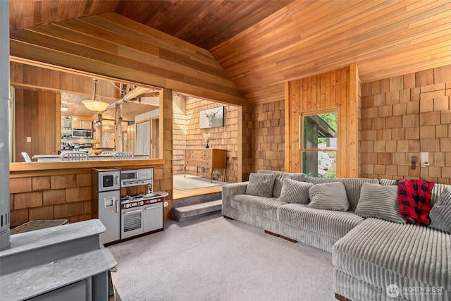 16845 Second Creek Rd, Leavenworth, WA 98826 - carpeted living area featuring wood walls, vaulted ceiling, and wooden ceiling