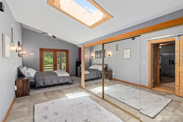 16845 Second Creek Rd, Leavenworth, WA 98826 - bedroom featuring a skylight, refrigerator with ice dispenser, vaulted ceiling, a closet, and french doors