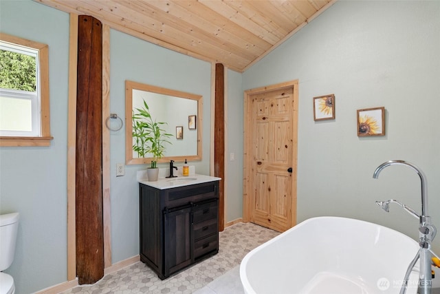 16845 Second Creek Rd, Leavenworth, WA 98826 - full bath with a freestanding bath, vaulted ceiling, vanity, tile patterned floors, and wood ceiling