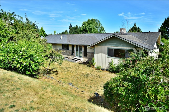 113 19th Ave SE, Puyallup, WA 98372 - view of front of home featuring a front lawn and a chimney