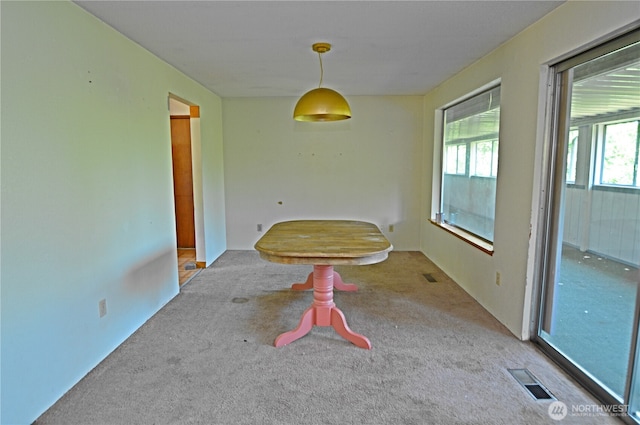 113 19th Ave SE, Puyallup, WA 98372 - unfurnished dining area featuring carpet flooring