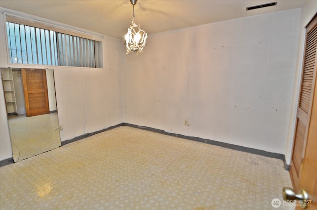 113 19th Ave SE, Puyallup, WA 98372 - empty room with tile patterned floors and a chandelier
