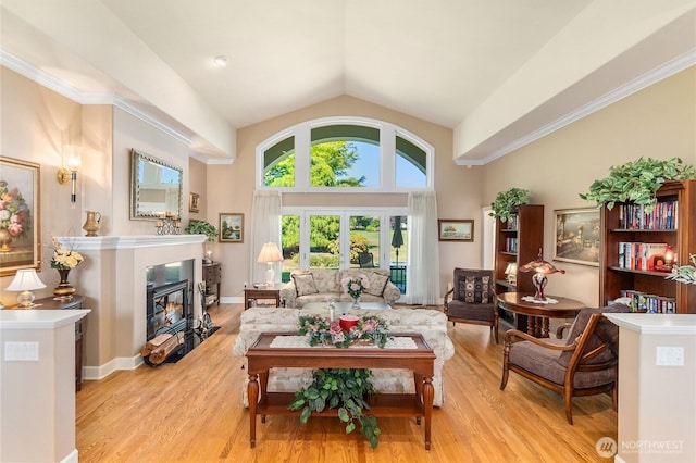 3912 Prestwick Ln SE, Olympia, WA 98501 - living area with a fireplace with flush hearth, light wood finished floors, and lofted ceiling