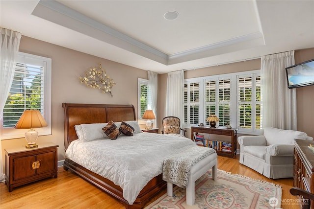 3912 Prestwick Ln SE, Olympia, WA 98501 - bedroom featuring a tray ceiling, light wood-style flooring, and crown molding