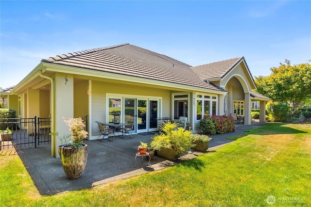 3912 Prestwick Ln SE, Olympia, WA 98501 - rear view of house with a patio area, a tile roof, and stucco siding