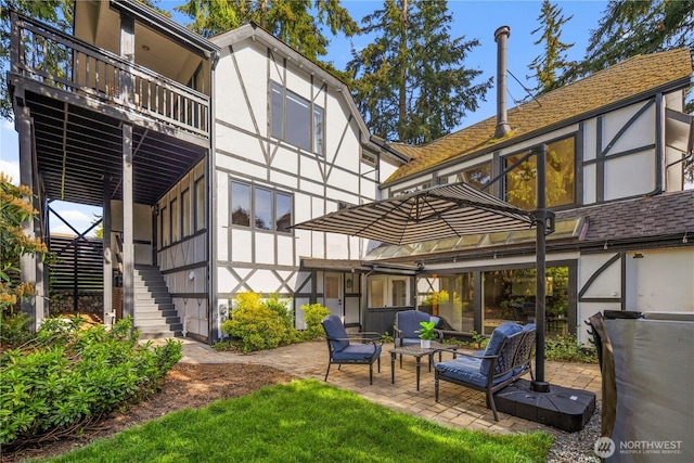 118 NW 132nd St, Seattle, WA 98177 - rear view of house with stairway, a patio, and stucco siding