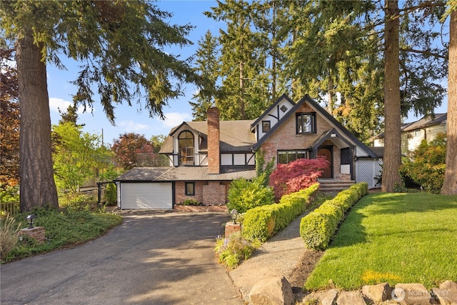 118 NW 132nd St, Seattle, WA 98177 - tudor-style house featuring asphalt driveway, a chimney, a front lawn, and brick siding