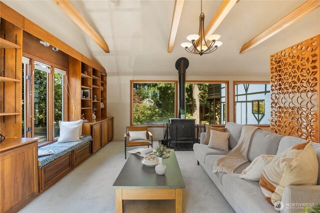 118 NW 132nd St, Seattle, WA 98177 - living room featuring a wood stove, light carpet, and a chandelier