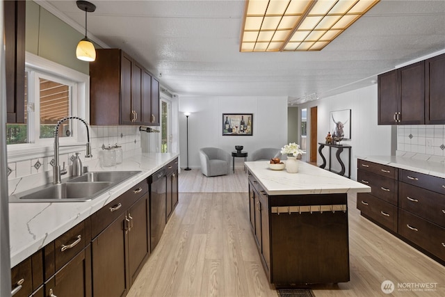 27114 320th Ave SE, Ravensdale, WA 98051 - kitchen featuring light wood-style floors, backsplash, dishwashing machine, and a center island