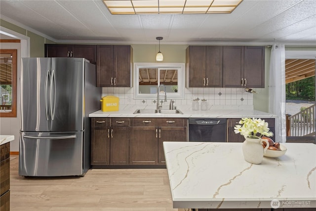27114 320th Ave SE, Ravensdale, WA 98051 - kitchen with freestanding refrigerator, dishwasher, backsplash, light wood-style floors, and dark brown cabinetry