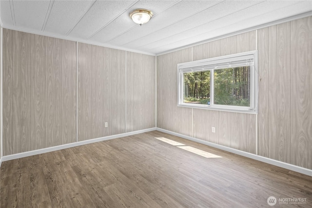 27114 320th Ave SE, Ravensdale, WA 98051 - unfurnished room featuring wood finished floors and wood walls