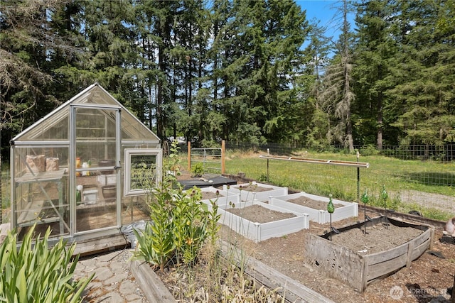 27114 320th Ave SE, Ravensdale, WA 98051 - view of yard featuring a greenhouse, a vegetable garden, and an outdoor structure