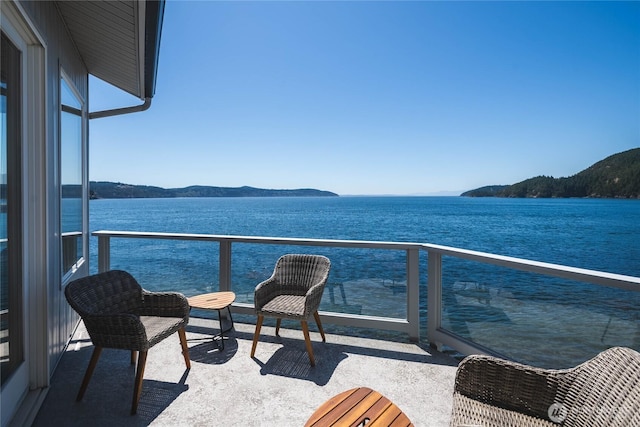 2401 Skyline Way Unit 203E, Anacortes, WA 98221 - balcony featuring a water and mountain view