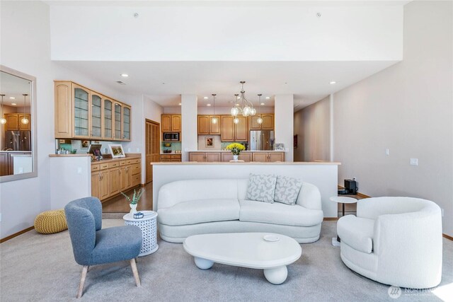 2401 Skyline Way Unit 203E, Anacortes, WA 98221 - carpeted living room featuring recessed lighting and a chandelier
