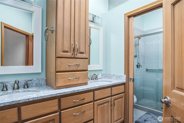2401 Skyline Way Unit 203E, Anacortes, WA 98221 - full bathroom featuring double vanity and a shower stall
