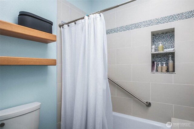 2401 Skyline Way Unit 203E, Anacortes, WA 98221 - bathroom featuring toilet and shower / bath combo with shower curtain
