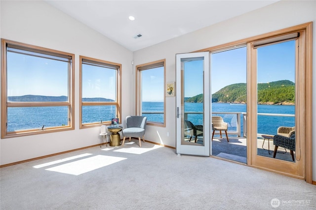 2401 Skyline Way Unit 203E, Anacortes, WA 98221 - living area featuring a water and mountain view, carpet floors, lofted ceiling, healthy amount of natural light, and recessed lighting
