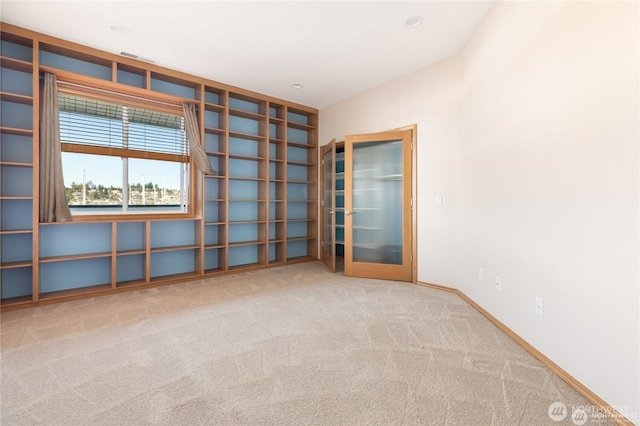 2401 Skyline Way Unit 203E, Anacortes, WA 98221 - spare room featuring carpet flooring and baseboards