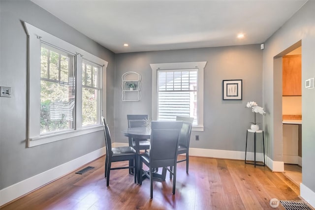5618 35th Ave SW, Seattle, WA 98126 - dining room featuring healthy amount of natural light, hardwood / wood-style flooring, and recessed lighting