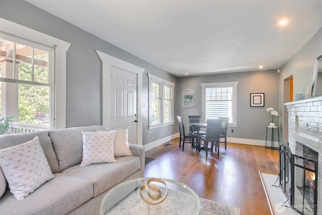 5618 35th Ave SW, Seattle, WA 98126 - living area featuring wood finished floors, a fireplace, and recessed lighting