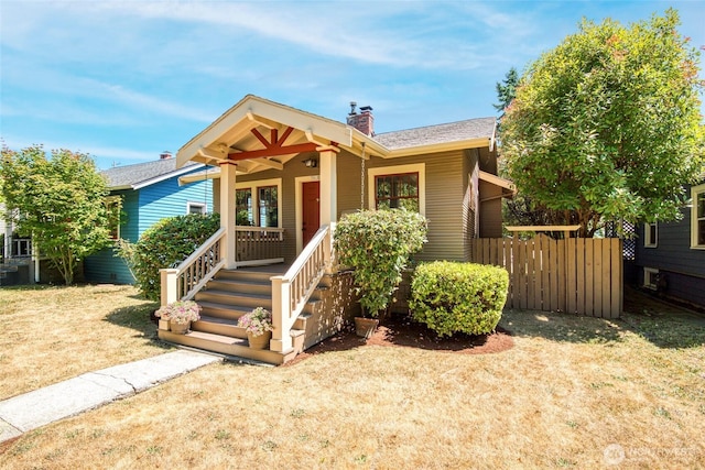 5618 35th Ave SW, Seattle, WA 98126 - view of front of house featuring a chimney and covered porch