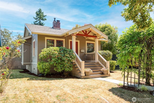 5618 35th Ave SW, Seattle, WA 98126 - view of front of property with a chimney, a porch, and a shingled roof