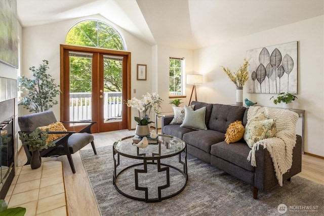 9004 20th Ave NE, Seattle, WA 98115 - living area featuring wood finished floors, lofted ceiling, and french doors