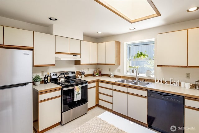 9004 20th Ave NE, Seattle, WA 98115 - kitchen with freestanding refrigerator, dishwasher, electric range, under cabinet range hood, and light countertops