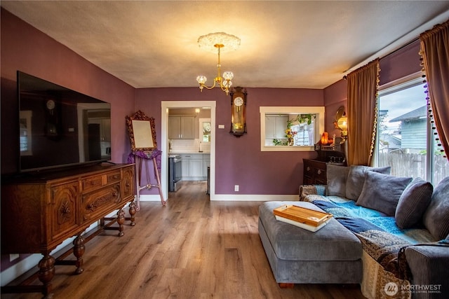 606 State St, Centralia, WA 98531 - living room with wood finished floors and a chandelier