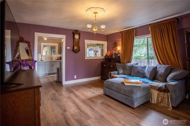 606 State St, Centralia, WA 98531 - living room featuring a chandelier and wood finished floors