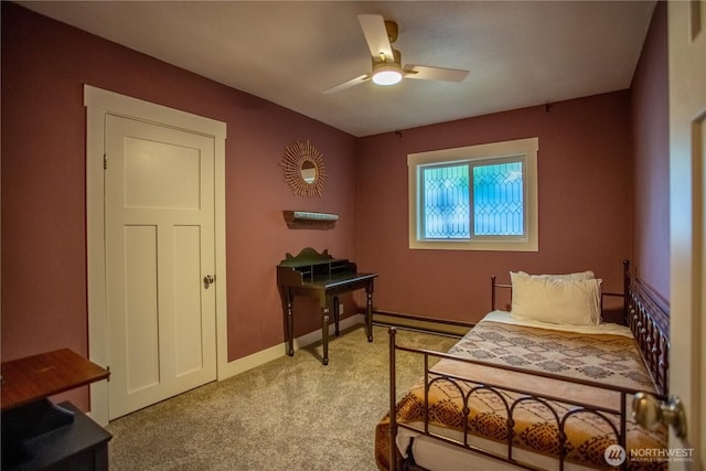 606 State St, Centralia, WA 98531 - bedroom with light colored carpet, baseboard heating, and a ceiling fan