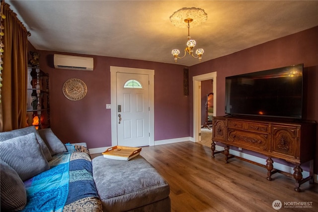606 State St, Centralia, WA 98531 - living area with an AC wall unit, a chandelier, and wood finished floors