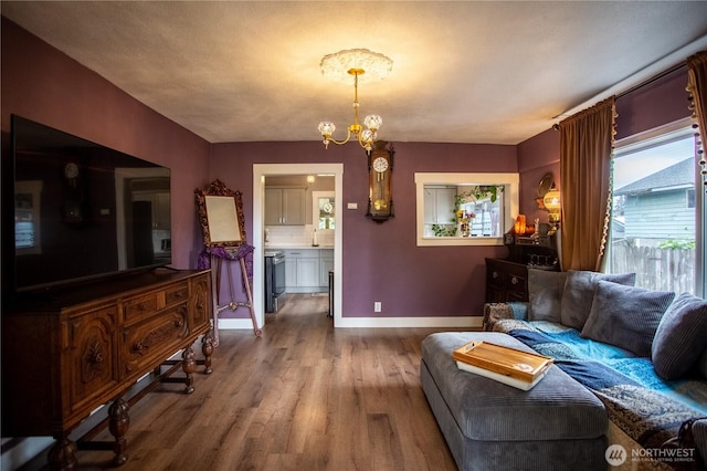 606 State St, Centralia, WA 98531 - living area featuring wood finished floors and a chandelier