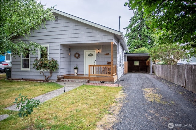 606 State St, Centralia, WA 98531 - view of front of home featuring asphalt driveway, a porch, and an attached carport