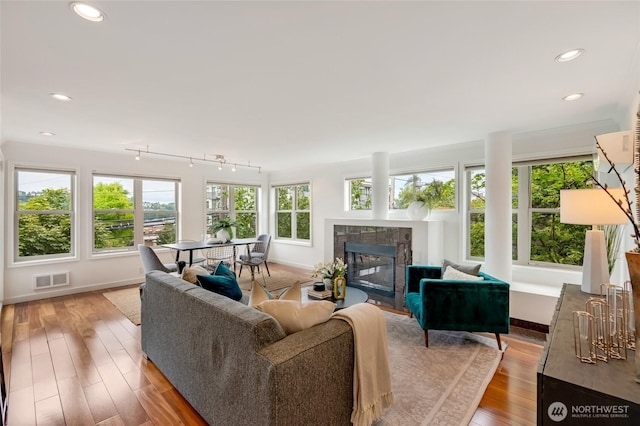 201 E Boston St Unit 2100, Seattle, WA 98102 - living room featuring light wood-style flooring, a tile fireplace, and recessed lighting