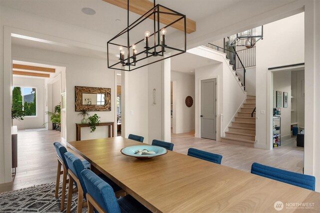 4405 88th Ave SE, Mercer Island, WA 98040 - dining area featuring a chandelier, stairs, and wood finished floors