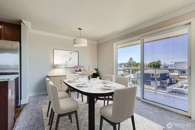 2514 57th Ave SW Unit 301, Seattle, WA 98116 - dining room with ornamental molding and baseboards