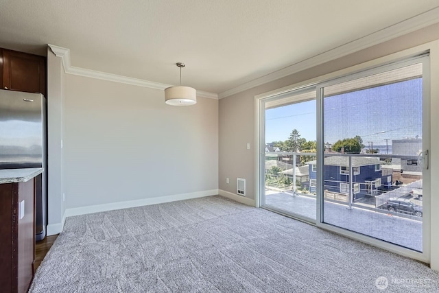 2514 57th Ave SW Unit 301, Seattle, WA 98116 - unfurnished dining area with ornamental molding and carpet flooring