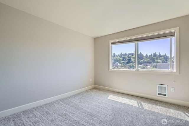 2514 57th Ave SW Unit 301, Seattle, WA 98116 - unfurnished room featuring carpet and heating unit