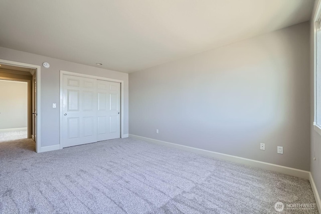 2514 57th Ave SW Unit 301, Seattle, WA 98116 - unfurnished bedroom with carpet flooring and a closet