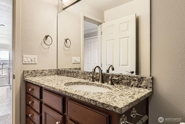 2514 57th Ave SW Unit 301, Seattle, WA 98116 - bathroom with vanity and a textured wall