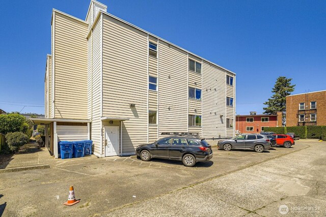 2514 57th Ave SW Unit 301, Seattle, WA 98116 - view of property with uncovered parking