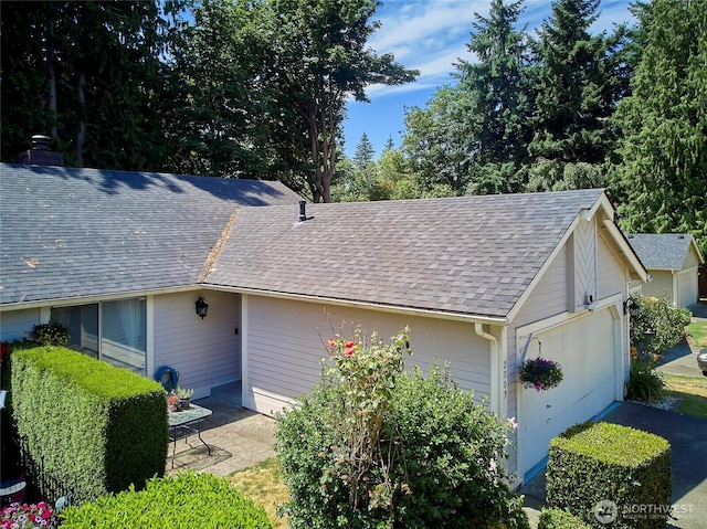 2003 SW 307th St Unit B, Federal Way, WA 98023 - view of property exterior featuring a shingled roof